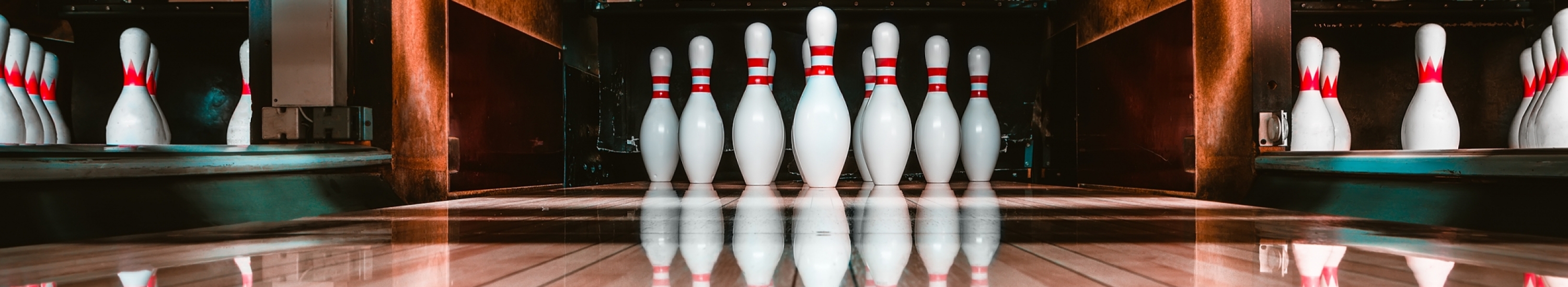 image down bowling alley showing bowling pins